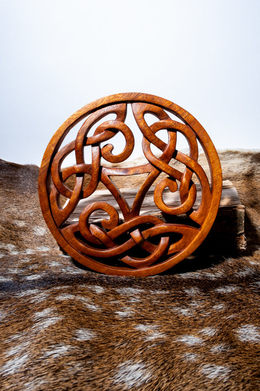 Wood carving Celtic triskelion