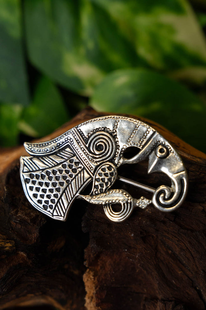 Vendel raven brooch Gotland, right-facing, silvered bronze