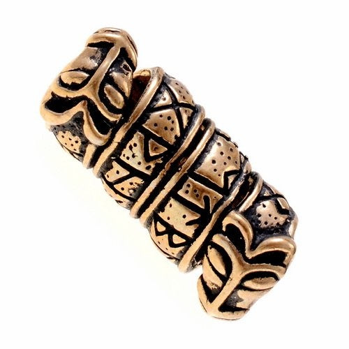 Koralik do brody z inskrypcją runiczną i głowami wilków, brąz