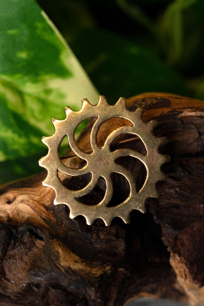 Romeinse schijffibula zonnewiel, brons