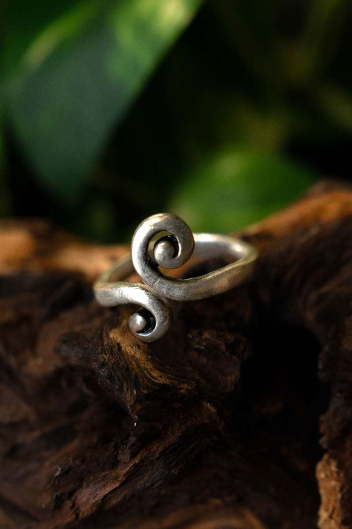 Celtic ring with stylized spiral motif, silvered bronze