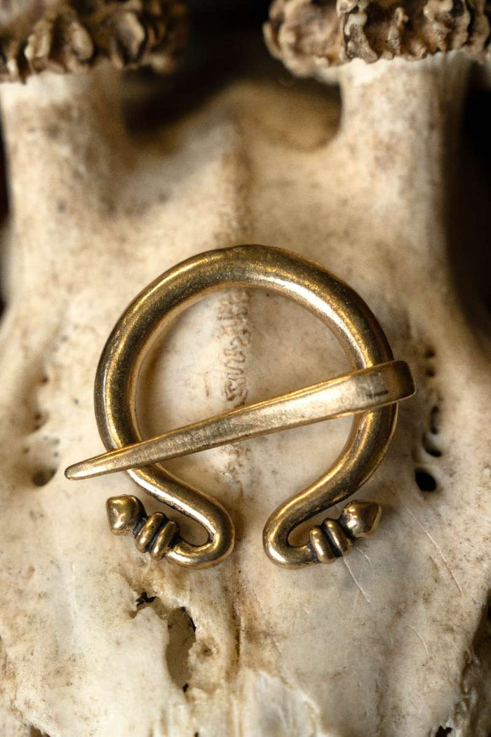 Small Roman Omega brooch, bronze