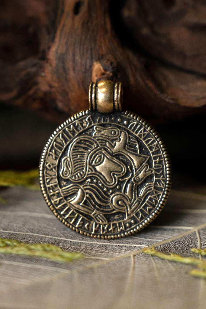 Vendel bracteate amulet Tjurko, bronze