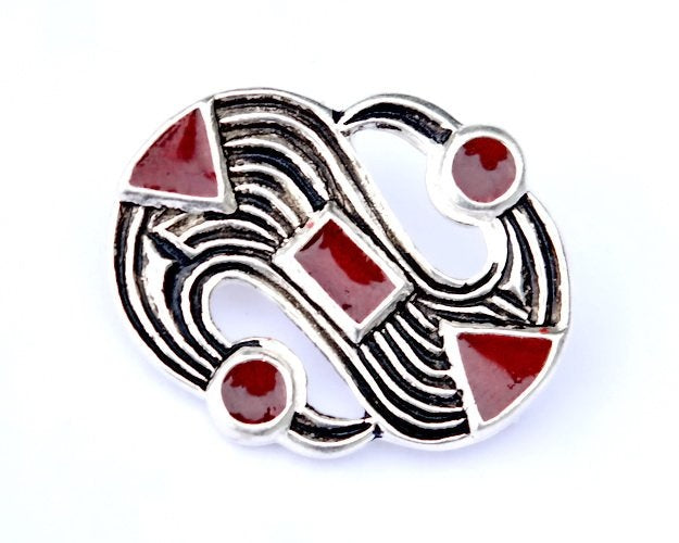 Senmerovingisk S-fibula, forsølvet bronze