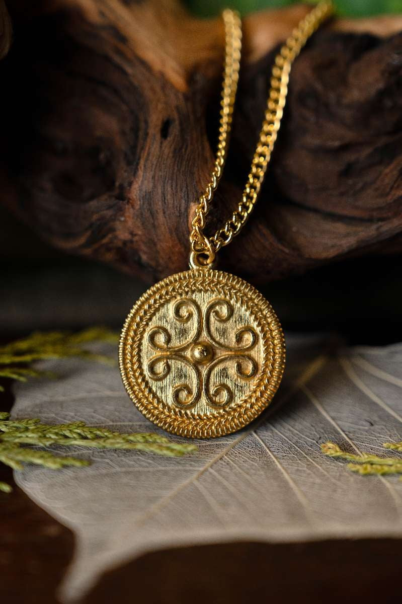 Roman filigree scroll pendant, 2nd-3rd century AD, pewter
