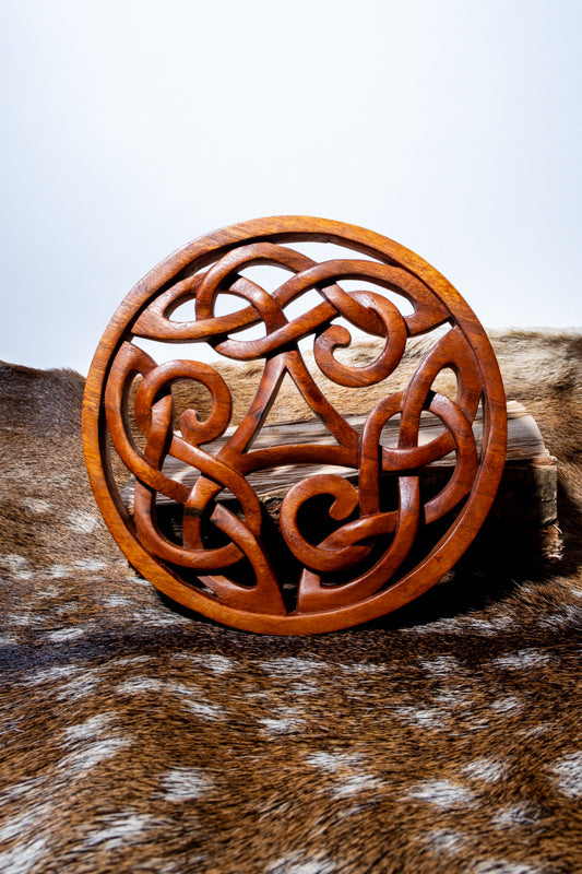 Wood carving Celtic triskelion
