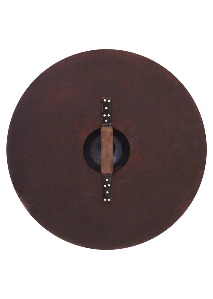 Beaten round shield