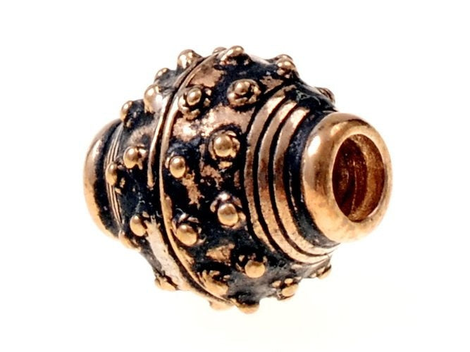 9th-10th century Viking beard bead, bronze