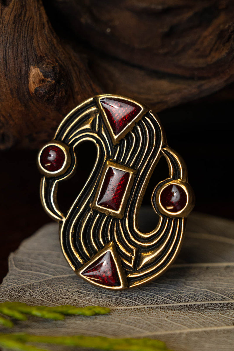 Fibula merovingia a S, bronzo