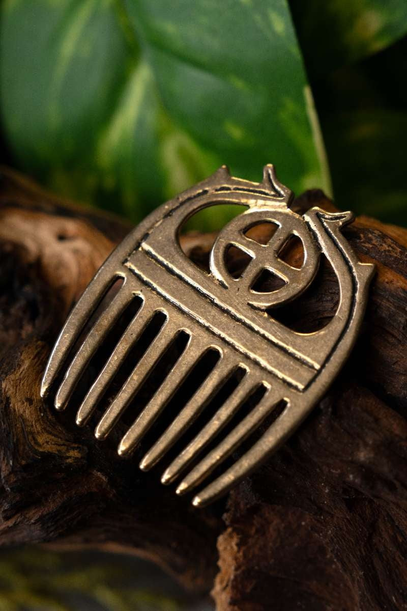 Bronze Age comb with sunwheel, bronze