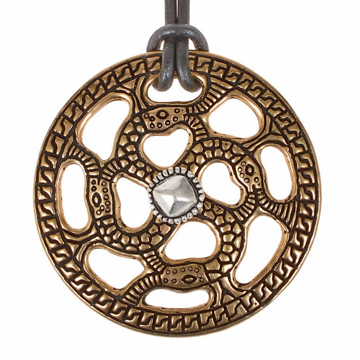 Alemannic decorative disc with snake motif, silvered bronze