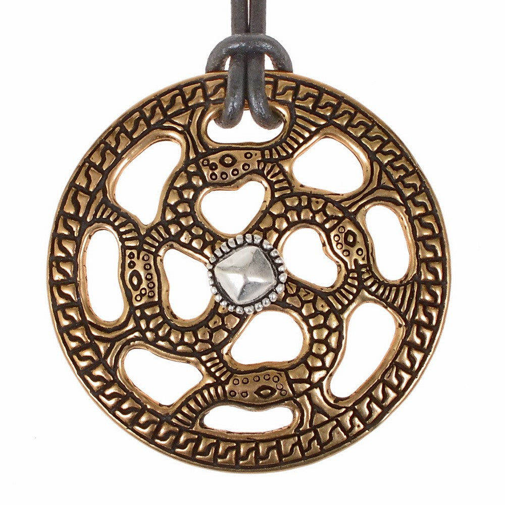 Alemannic decorative disc with snake motif, silvered bronze